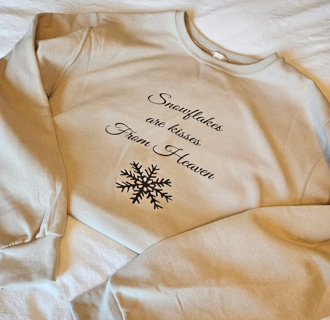 Tan snowflakes are from heaven crewneck