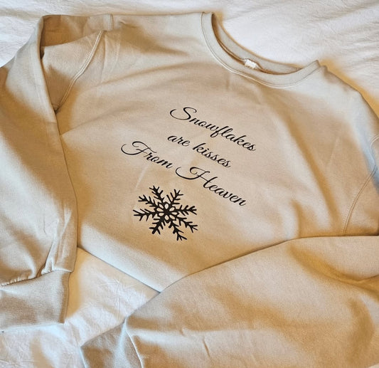 Tan snowflakes are from heaven crewneck